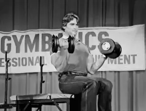 Arnold Schwarzenegger Holding a Dumbbells